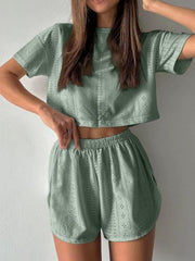 Sage perforated crop top and shorts set with elastic waist shorts.
