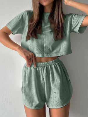 Sage perforated crop top and shorts set with elastic waist shorts.