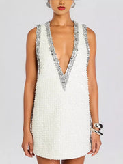 White sequin mini dress with plunging V-neck and silver sequin trim