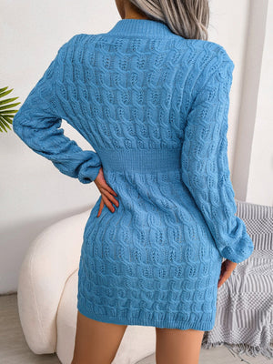 Cerulean cable knit mini dress with long sleeves and a sculpted fit.