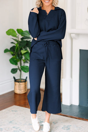 Navy textured polo top and wide-leg culottes set with drawstring waist.