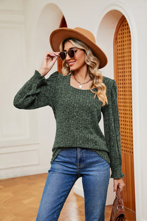 Textured knit blouse in Matcha Green with square neckline and cuffed sleeves.