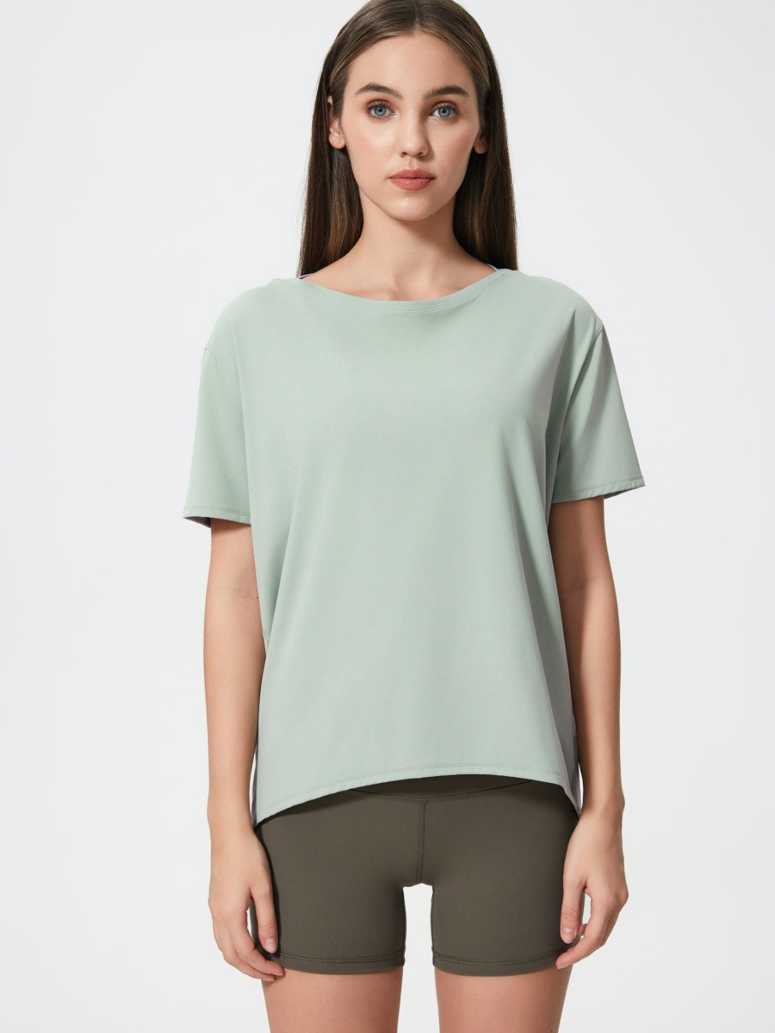 Relaxed fit light green performance tee with crew neck and short sleeves.