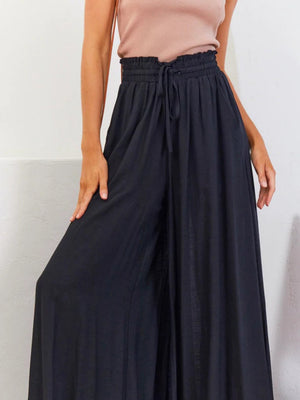 Black gathered waist wide-leg palazzo maternity pants with drawstring.
