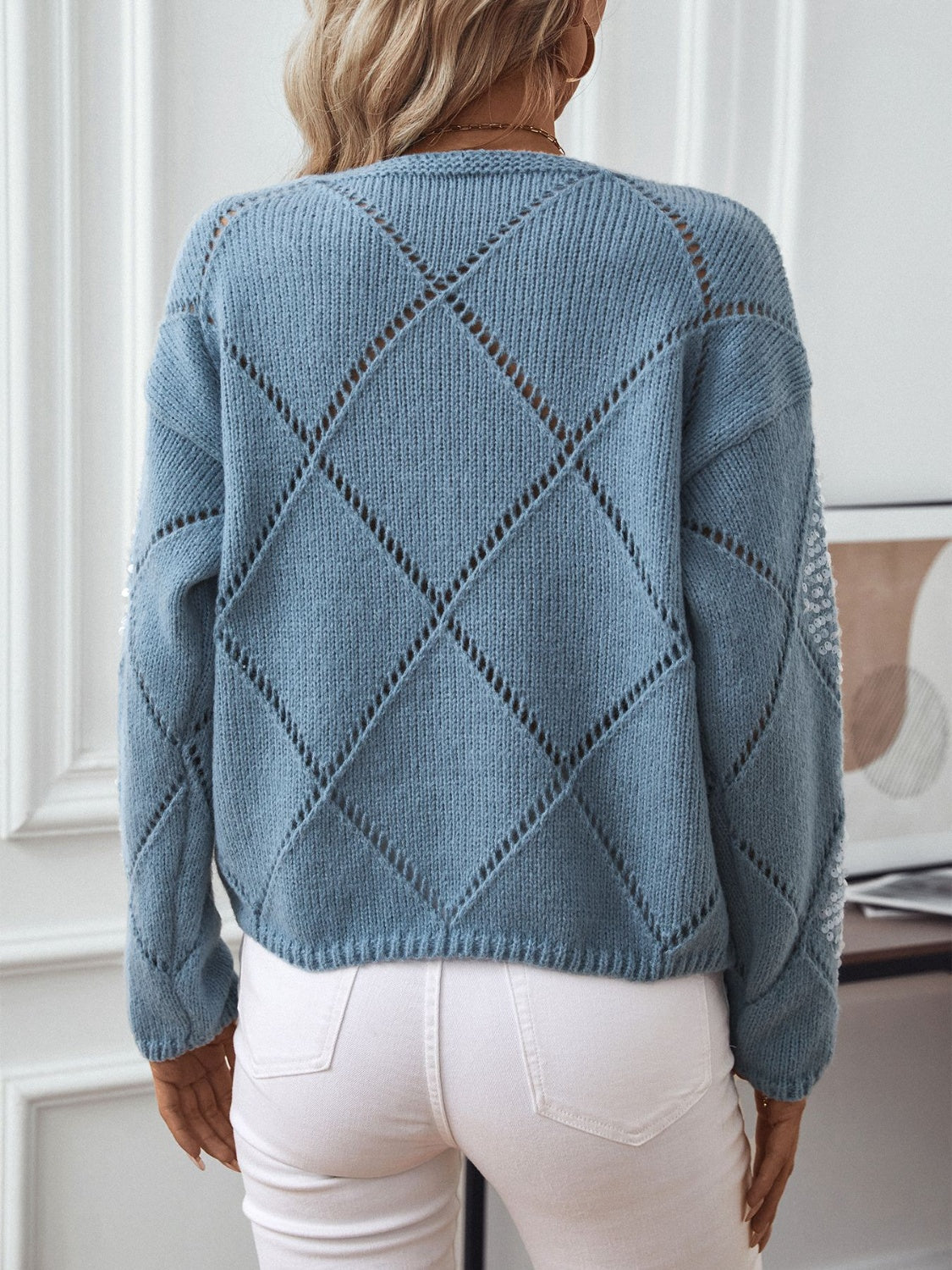 Dusty Blue diamond knit sweater with sequin detail on sleeves.