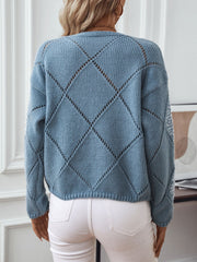 Dusty Blue diamond knit sweater with sequin detail on sleeves.