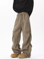 Khaki cargo sweatpants with drawstring waist and utility pockets.