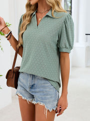 Eyelet collar top in sage green with puff sleeves and a v-neck.