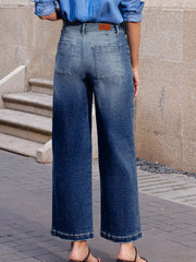 Patch pocket wide-leg jeans in medium wash denim with a gradient effect.