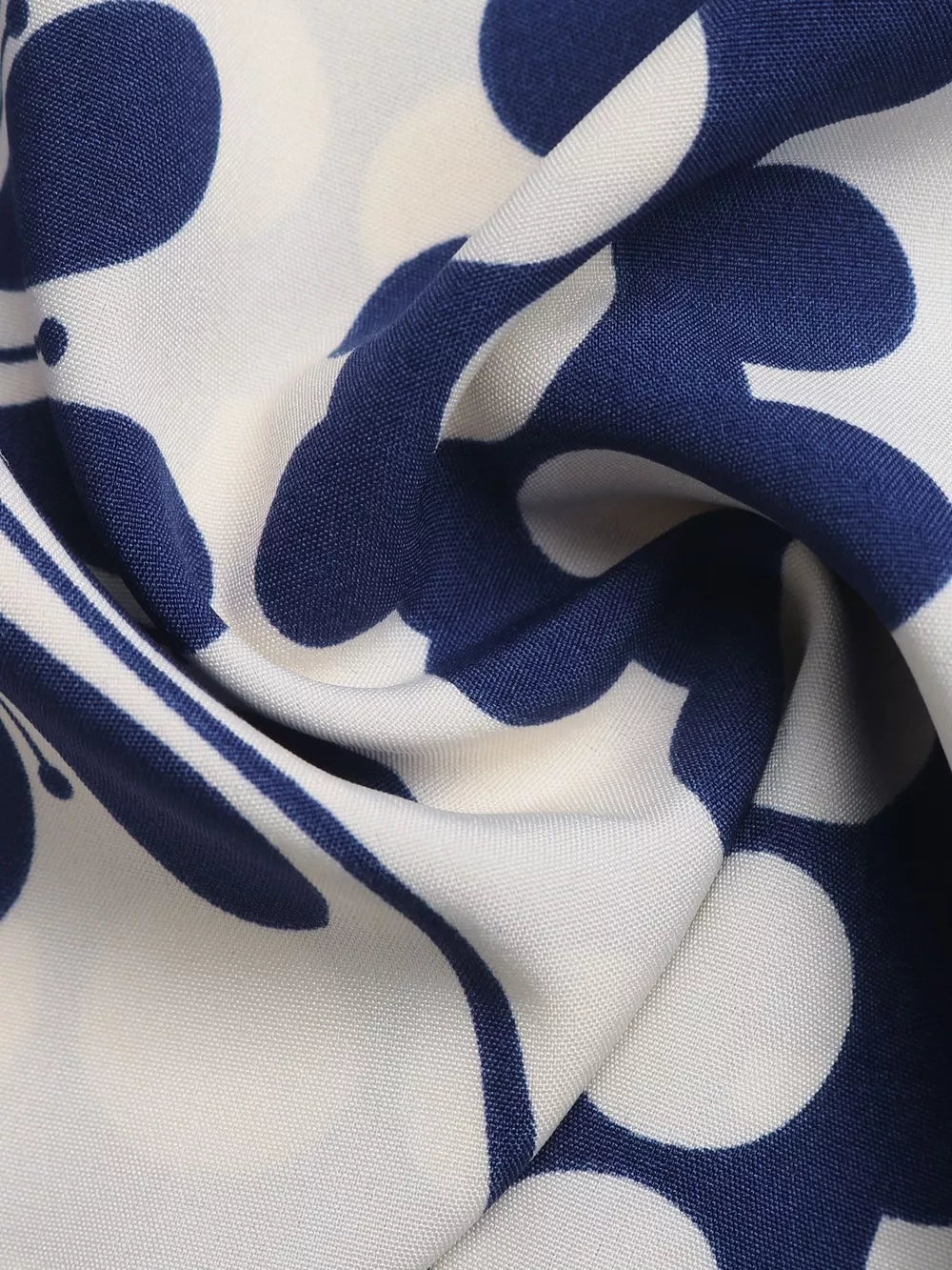 Maxi dress fabric detail with a blue and white abstract floral pattern