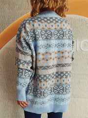 Light blue acrylic oversized Fair Isle knit sweater with a crew neck and ribbed cuffs.