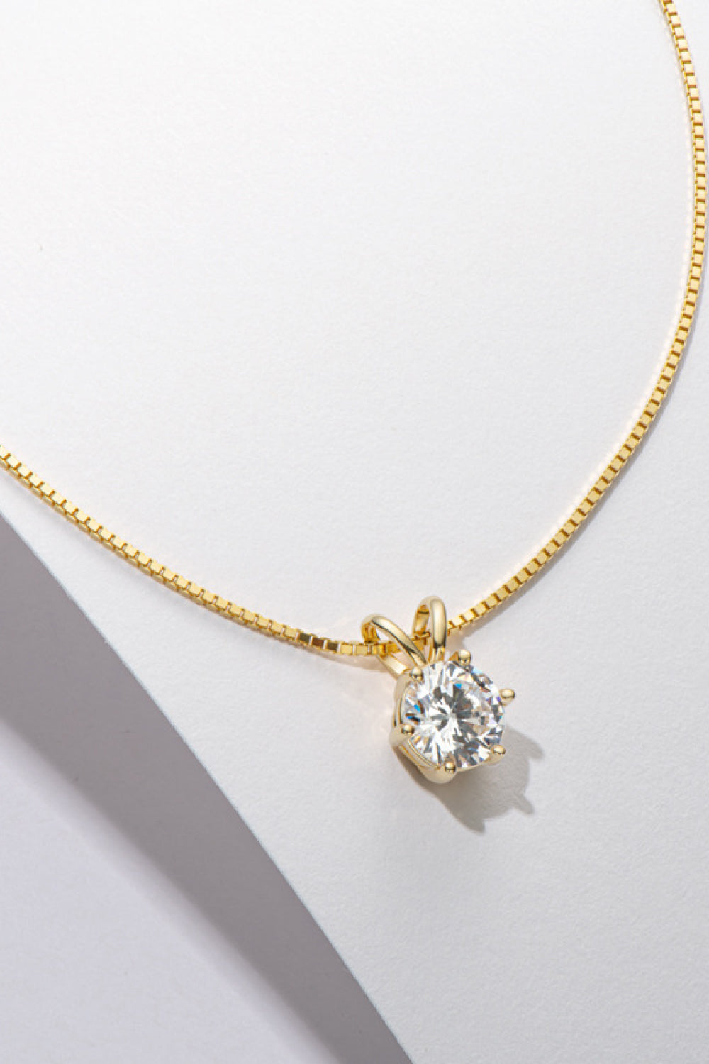 Gold moissanite pendant necklace with 1 carat round brilliant cut stone on 925 silver chain
