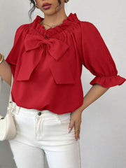 Red ruffled bow sleeve blouse with cinched neckline and ruffled cuffs.