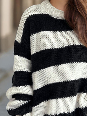 Chunky knit jumper with bold black and white stripes, crew neck, and relaxed fit.