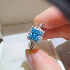 Silver ring with bright ice blue square halo diamond engagement ring