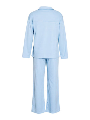 Light blue ribbed knit lounge set with relaxed fit long sleeve top and wide leg pants.