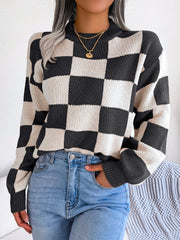 Checkerboard knit mock neck pullover sweater in black and cream acrylic.
