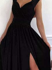 Black maxi dress with sweetheart neckline, ruched waist, and high slit.