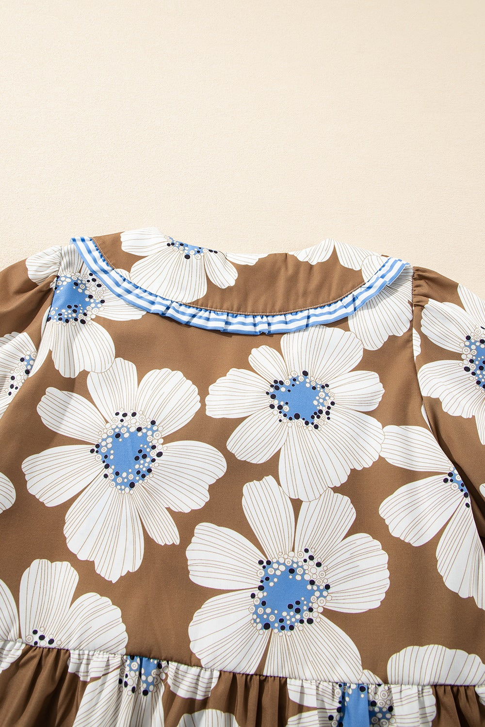 Camel floral print blouse with Peter Pan collar and blue stripe trim