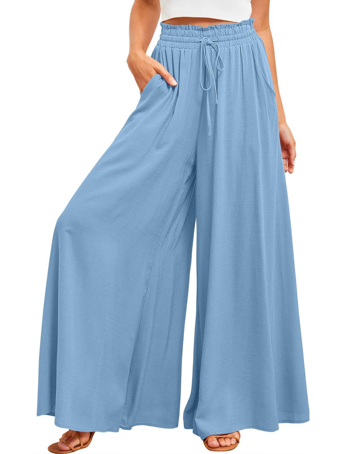 Light blue textured drawstring palazzo trousers with wide legs and pockets.