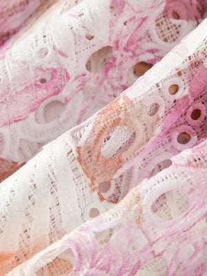 Luxe floral lace maxi gown in pink and white with cutout details.
