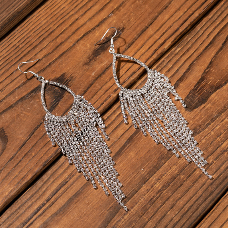 Crystal raindrop chandelier earrings with cascading rhinestone fringe.