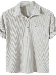 Textured ribbed polo shirt in ivory with rolled sleeves and chest pocket.