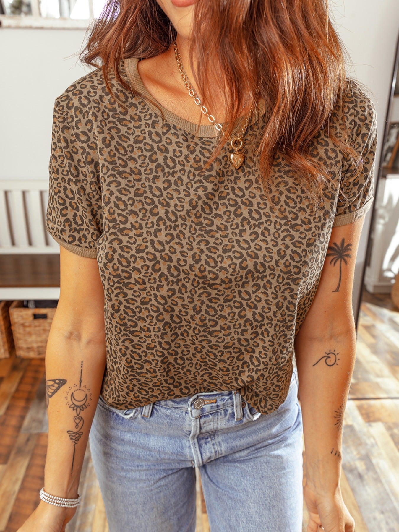 Leopard print relaxed fit t-shirt with short sleeves and a crew neck, styled with jeans.