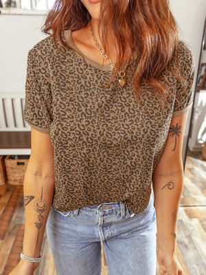 Leopard print relaxed fit t-shirt with short sleeves and a crew neck, styled with jeans.