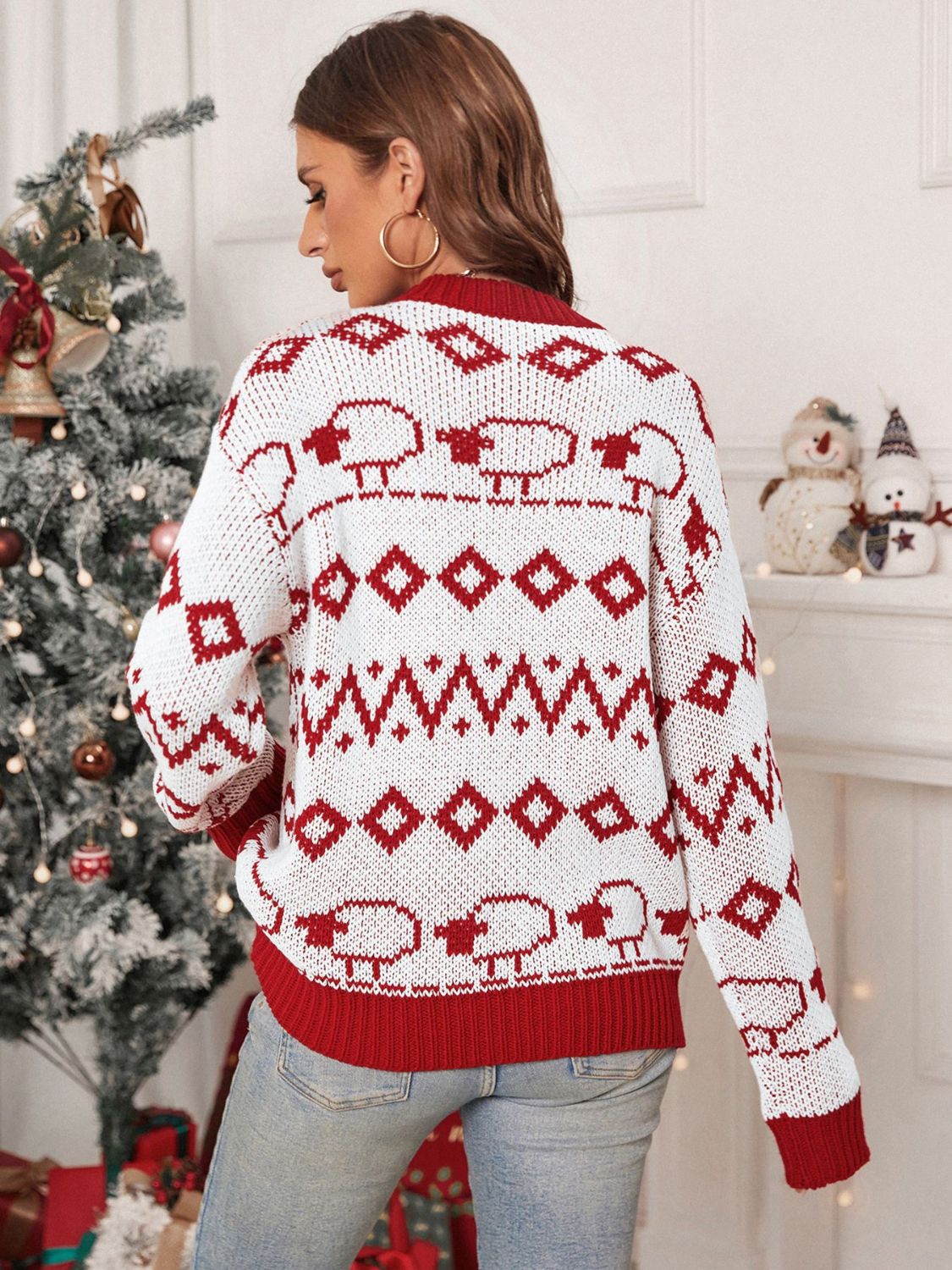 White acrylic crewneck sweater with red sheep and diamond pattern, ribbed cuffs and hem