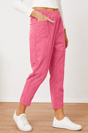 Hot Pink corduroy barrel-leg utility pants with elastic waist and pockets.