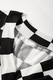 Black and white checkered outfit set detail showing neckline and stitching