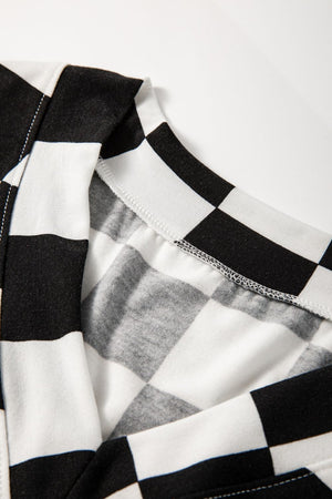 Black and white checkered outfit set detail showing neckline and stitching