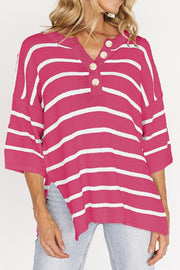 Hot pink and white stripe knit pullover with button-down henley neckline and 3/4 sleeves.