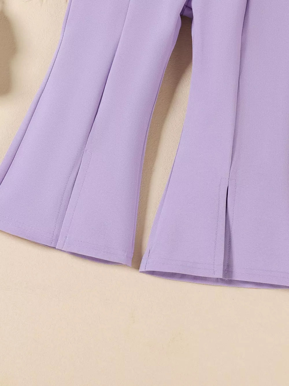 Purple baby flare pants with side slits and detailed stitching.