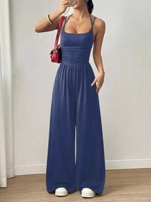 Royal Blue ruched wide-leg jumpsuit with spaghetti straps and a cinched waist.