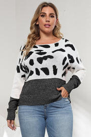 Dalmatian print colorblock knit sweater with crewneck and long sleeves.