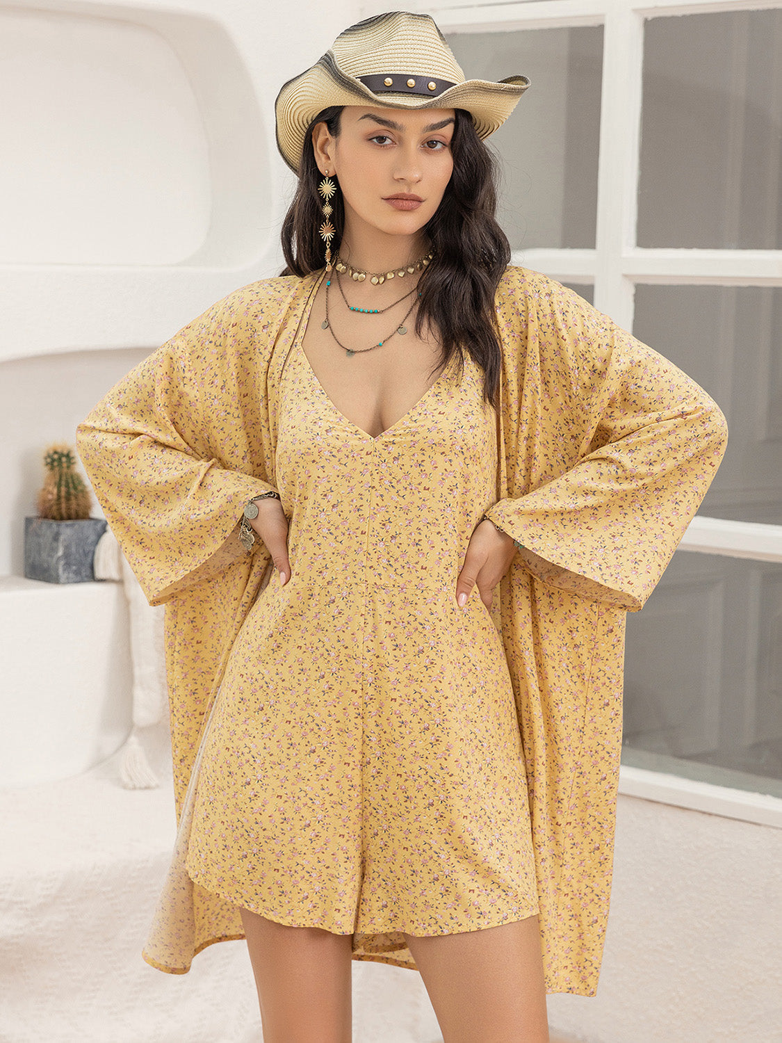 Yellow floral romper and kimono cover-up set with wide sleeves and V-neck romper.