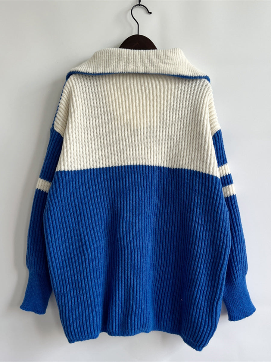 Varsity stripe acrylic sweater with ribbed collar and cuffs in royal blue and white.