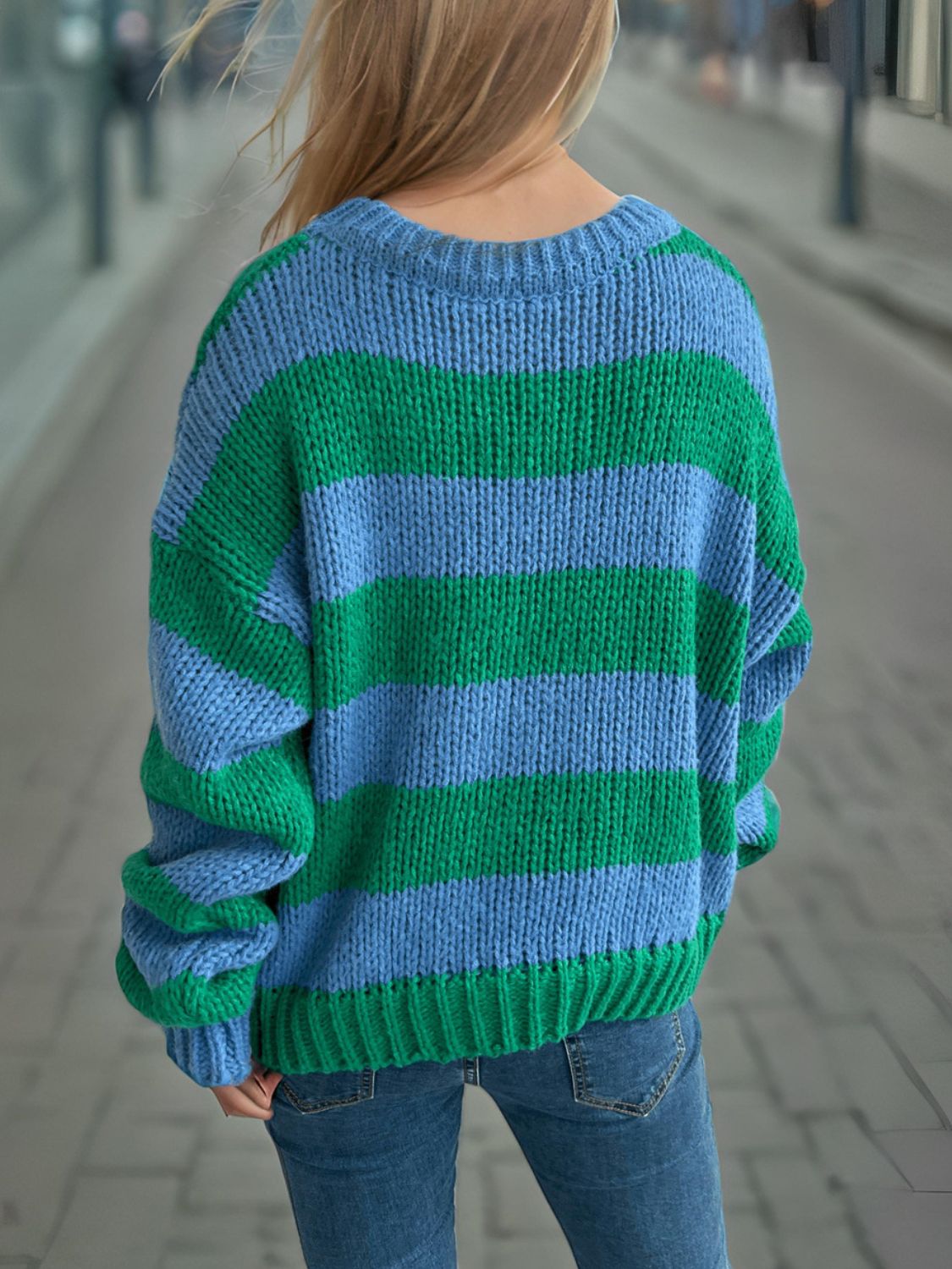 Chunky knit jumper with blue and green horizontal stripes, crew neck, long sleeves.