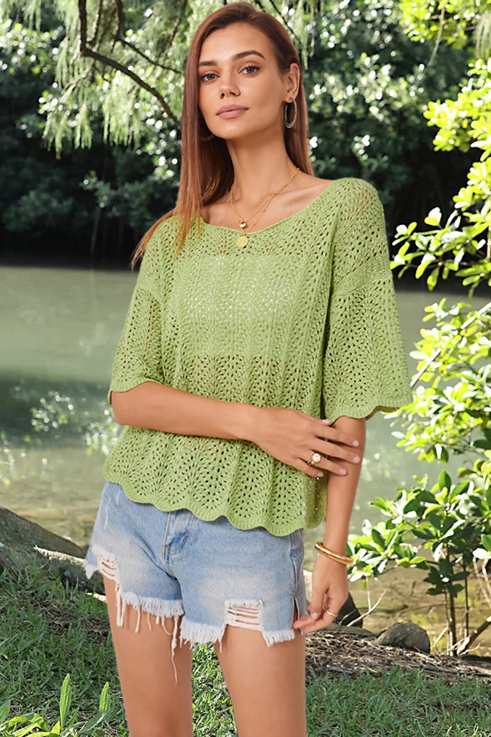 Light green open-knit top with scalloped sleeves and hem, featuring a relaxed fit and boat neckline.