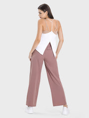 Relaxed drape drawstring palazzo pants in dusty rose, shown with a white tank top.