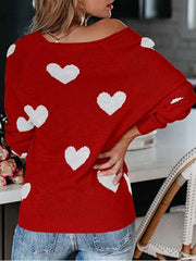 Deep Red heart motif raglan knit sweater with a relaxed fit.