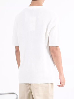 White textured knit henley undershirt with short sleeves and a crew neck.