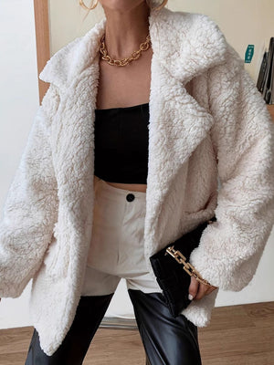 Cream teddy bear shawl collar jacket with button closure.