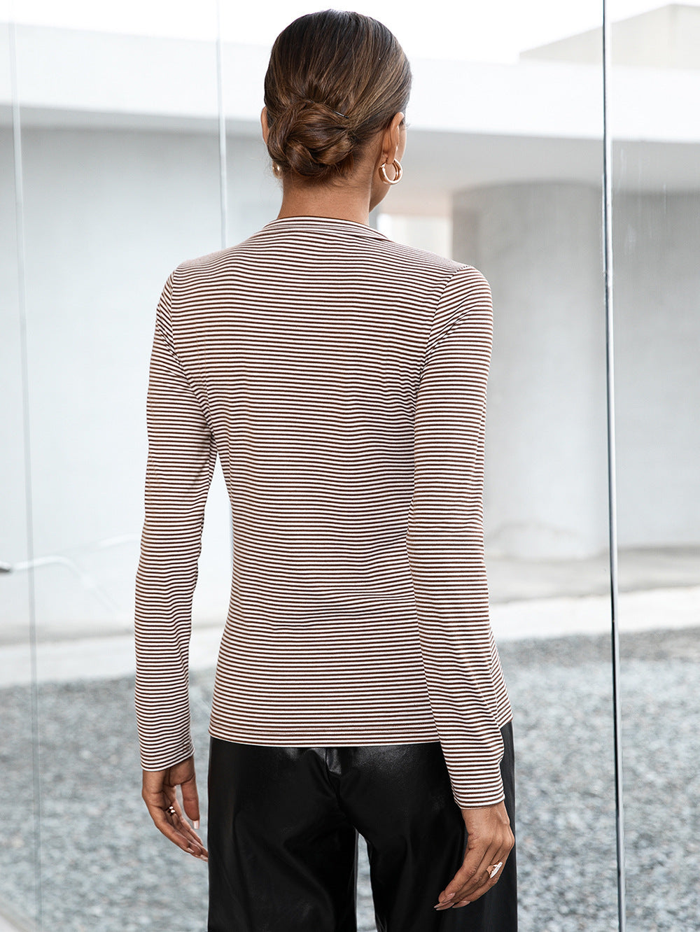 Ribbed Henley stripe top in gray with long sleeves and a buttoned neckline.