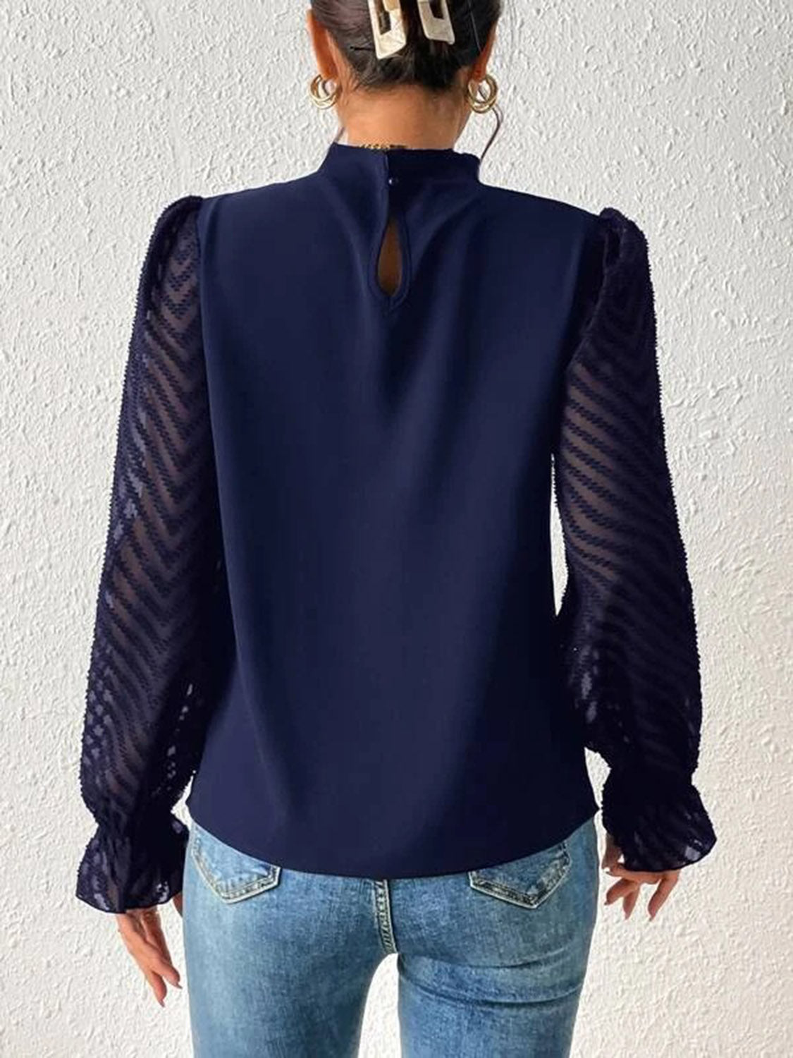 Navy blouse with ruffle neck and chevron sheer sleeves