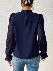 Navy blouse with ruffle neck and chevron sheer sleeves