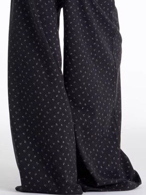 Men's dark floral wide leg sweatpants with a relaxed fit.