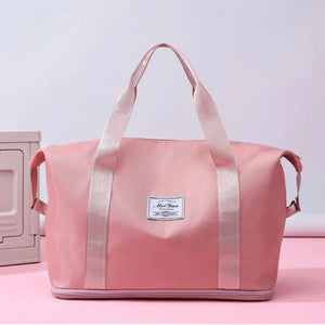 Weekend Escape Nylon Tote in Dusty Pink with dual handles and a central label.